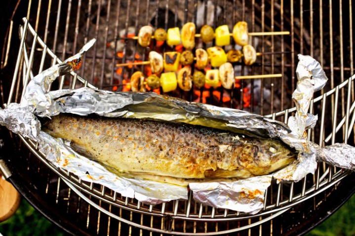 Barbecued trout with mushroom and potato skewers, close-up